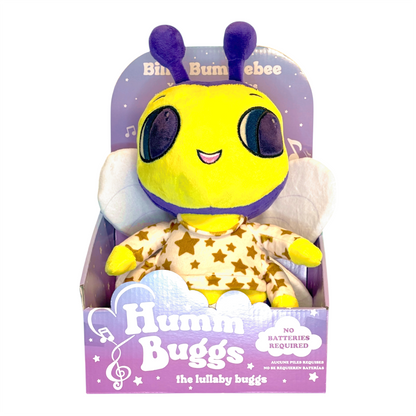 Plush toy bee in pajamas with 'Humm Buggs' packaging on a white background