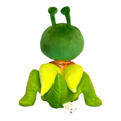 Green plush toy with a round body and long legs on a white background