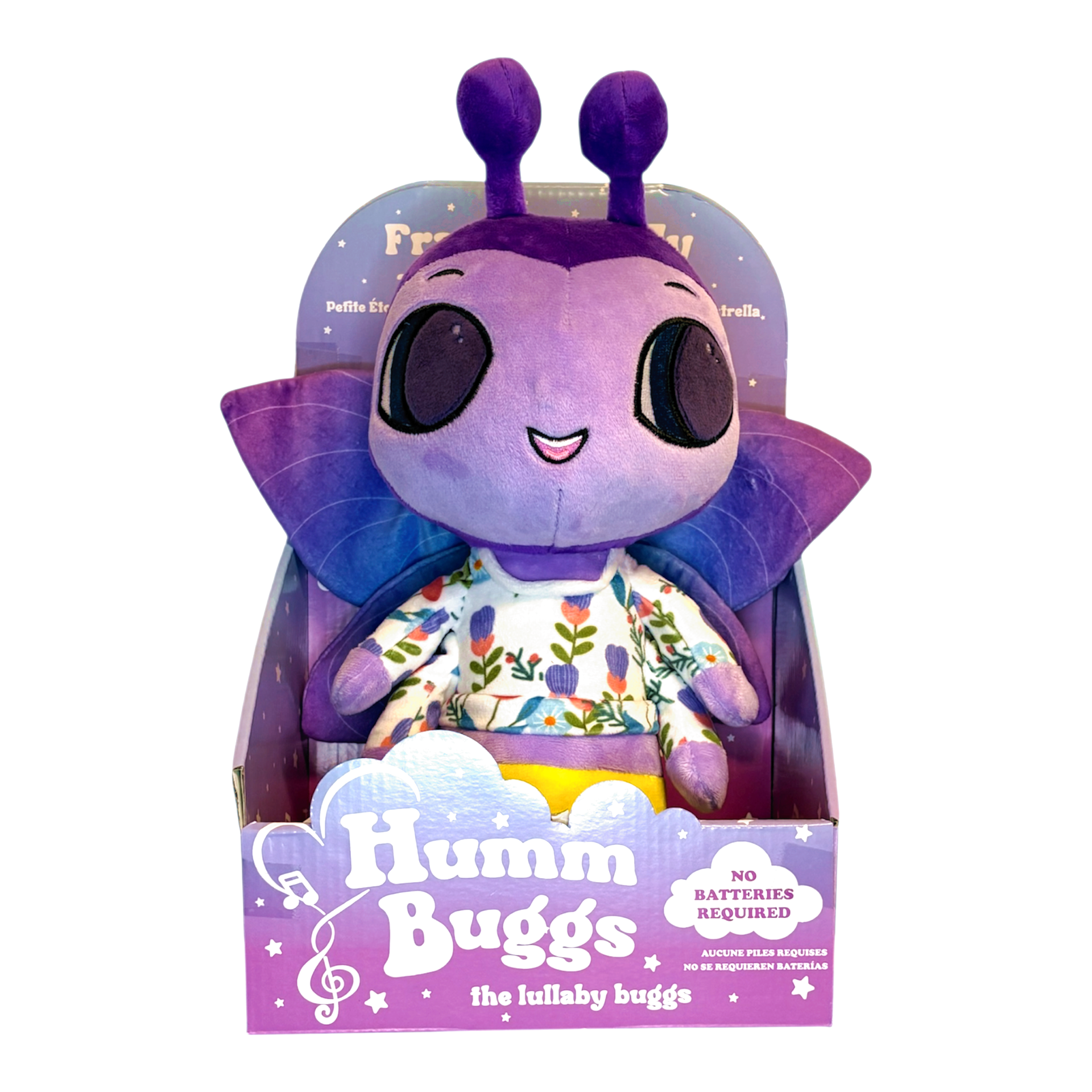 Purple plush toy with a smiling face and floral shirt in packaging, labeled 'Humm Buggs'.